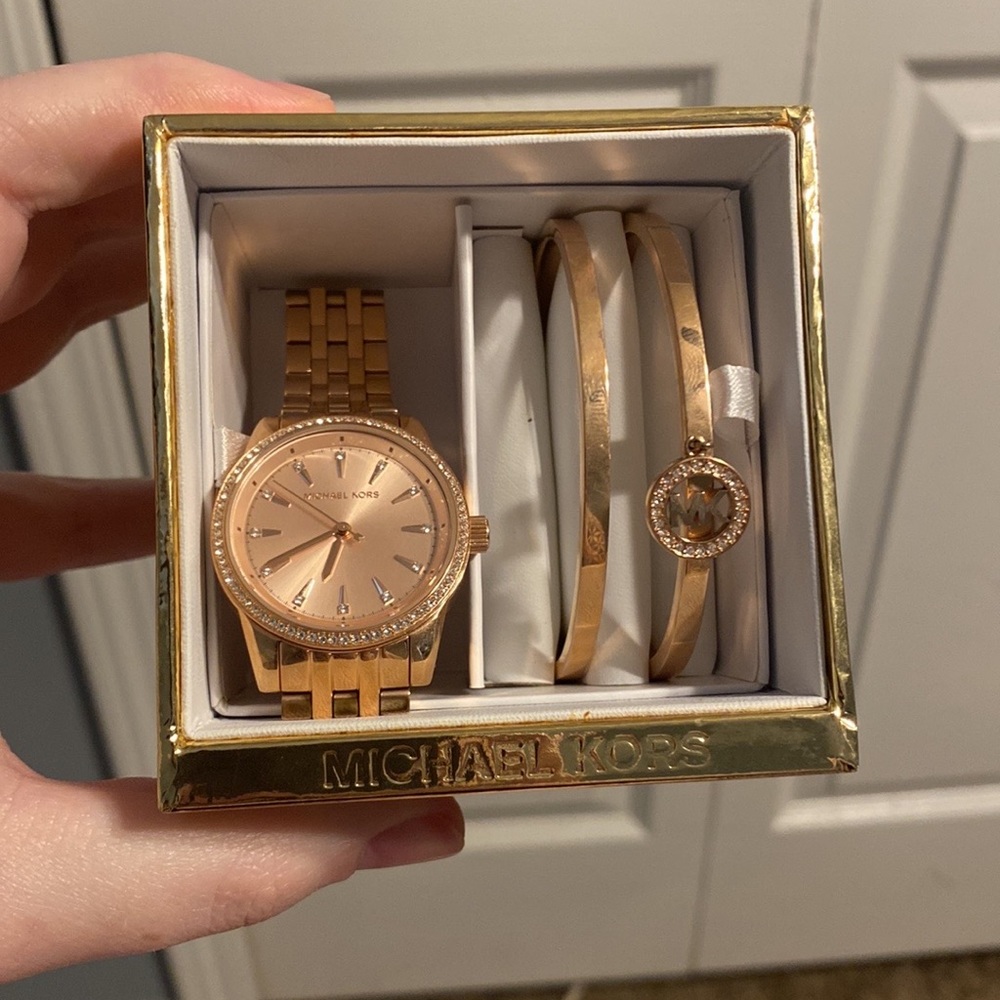 Brand new Michael Kors watch and bracelet set.